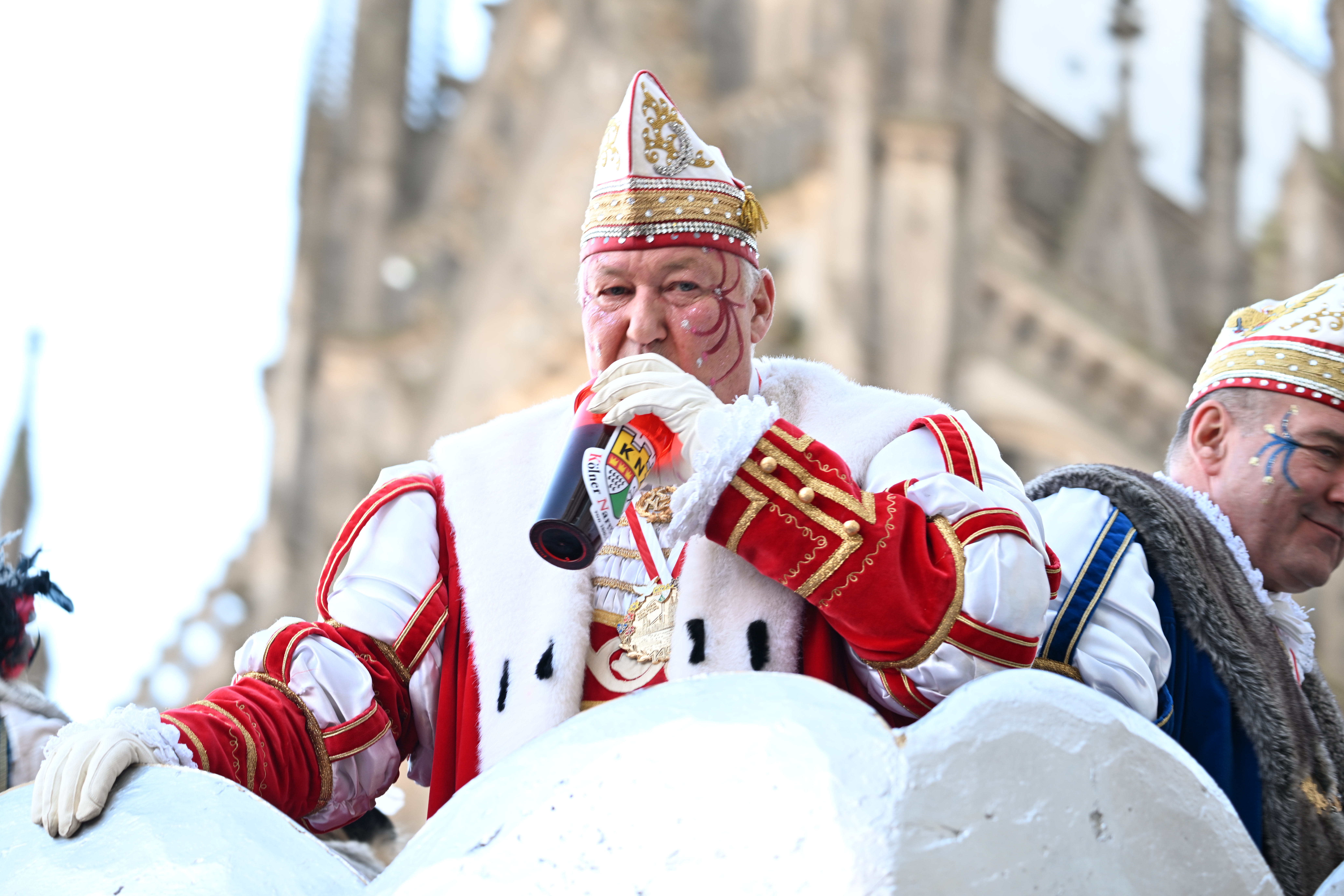 Photo of man dressed as king in parade float